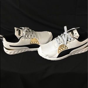 Gently used Black/white/gold Puma (size 10)